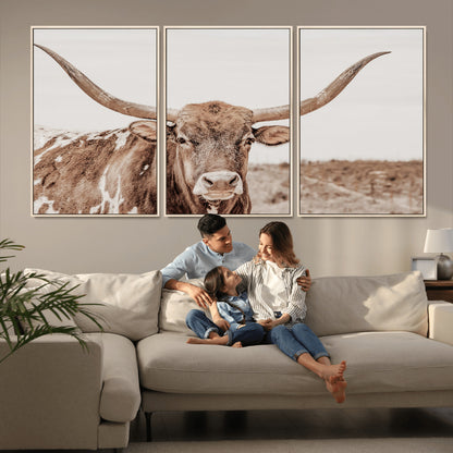 A longhorn cow in soft beige desert tones, standing calmly in open land, perfect for neutral western or rustic farmhouse interiors.