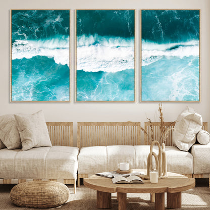 Aerial view of turquoise ocean waves crashing with white foam, perfect for tropical coastal or modern beach-style home decor.