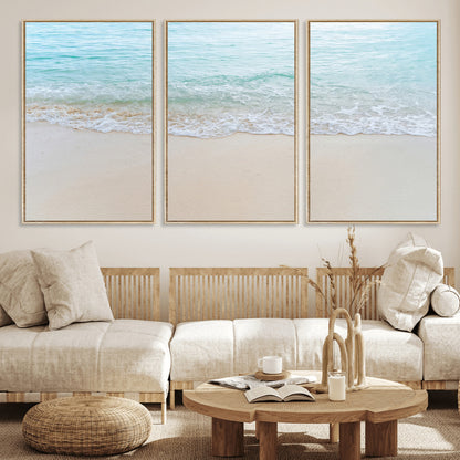 Soft shoreline with gentle aqua waves on smooth sand, ideal for minimalist coastal or pastel ocean-inspired home wall decor.