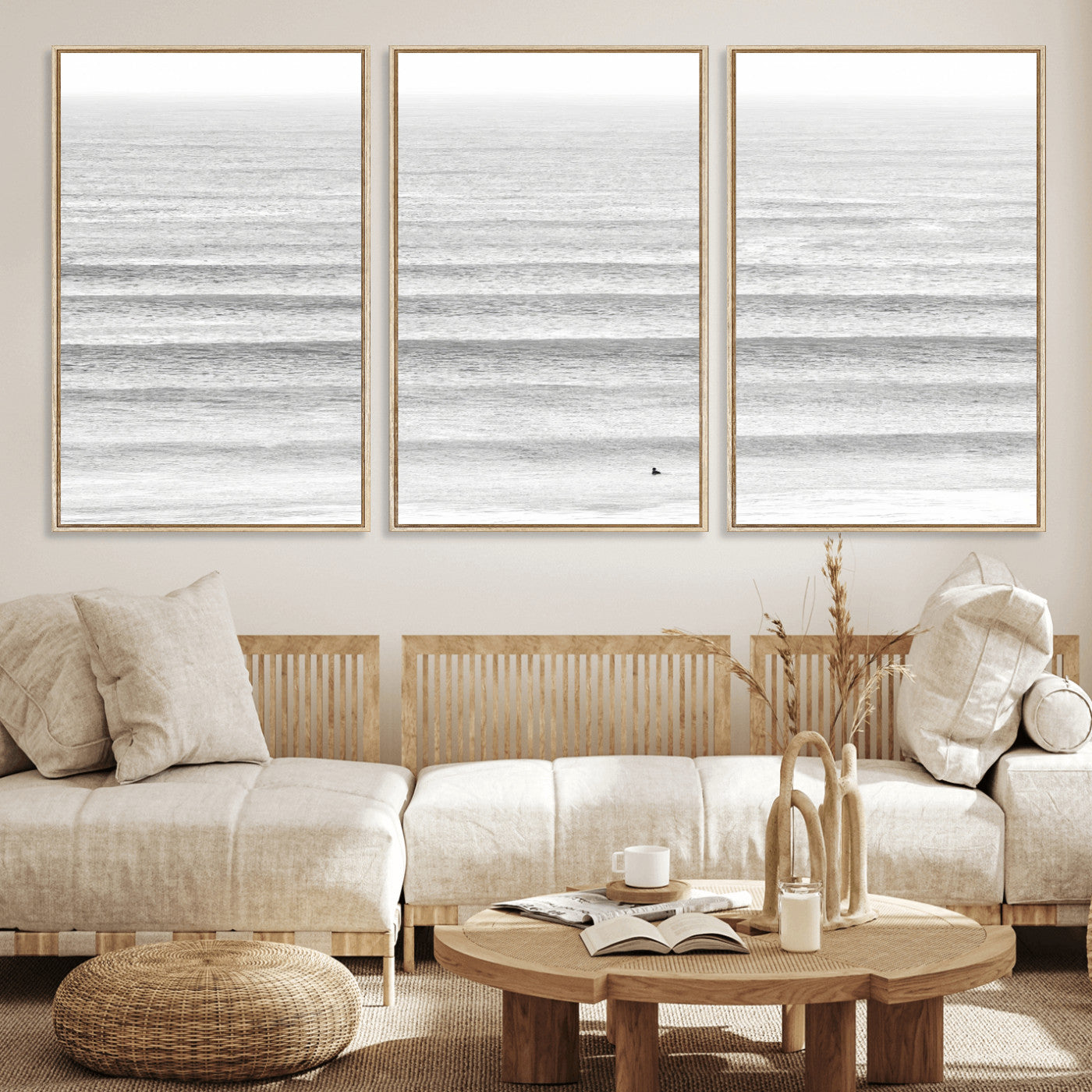 Monochrome photo of a lone surfer in calm layered waves, perfect for minimalist coastal or moody ocean-inspired wall decoration.