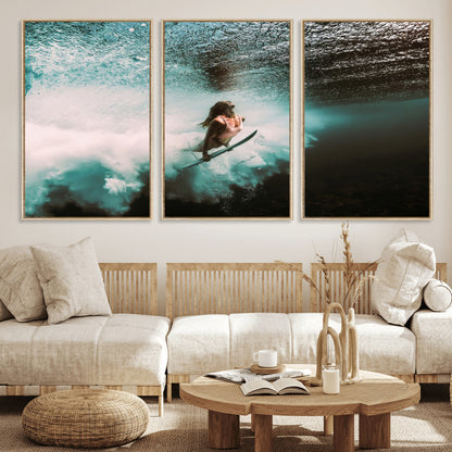 Vibrant underwater photo of a female surfer diving through turquoise waves, perfect for coastal boho or surf-inspired home decor.