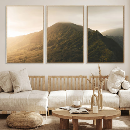 Sunlit mountain peak with mist rolling over its rugged slopes, bathed in golden light, creating a warm and tranquil nature-inspired scene.