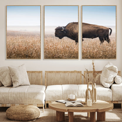A majestic bison standing in an open prairie field, its strong form blending into the golden grass under a vast blue sky, evoking the wild spirit of the American plains.
