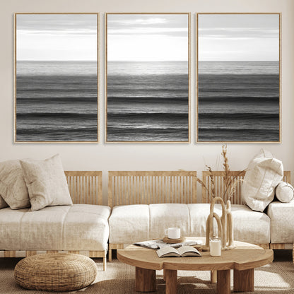 Minimalist black and white ocean view with layered waves reflecting sunlight, evoking a sense of calm and coastal serenity.