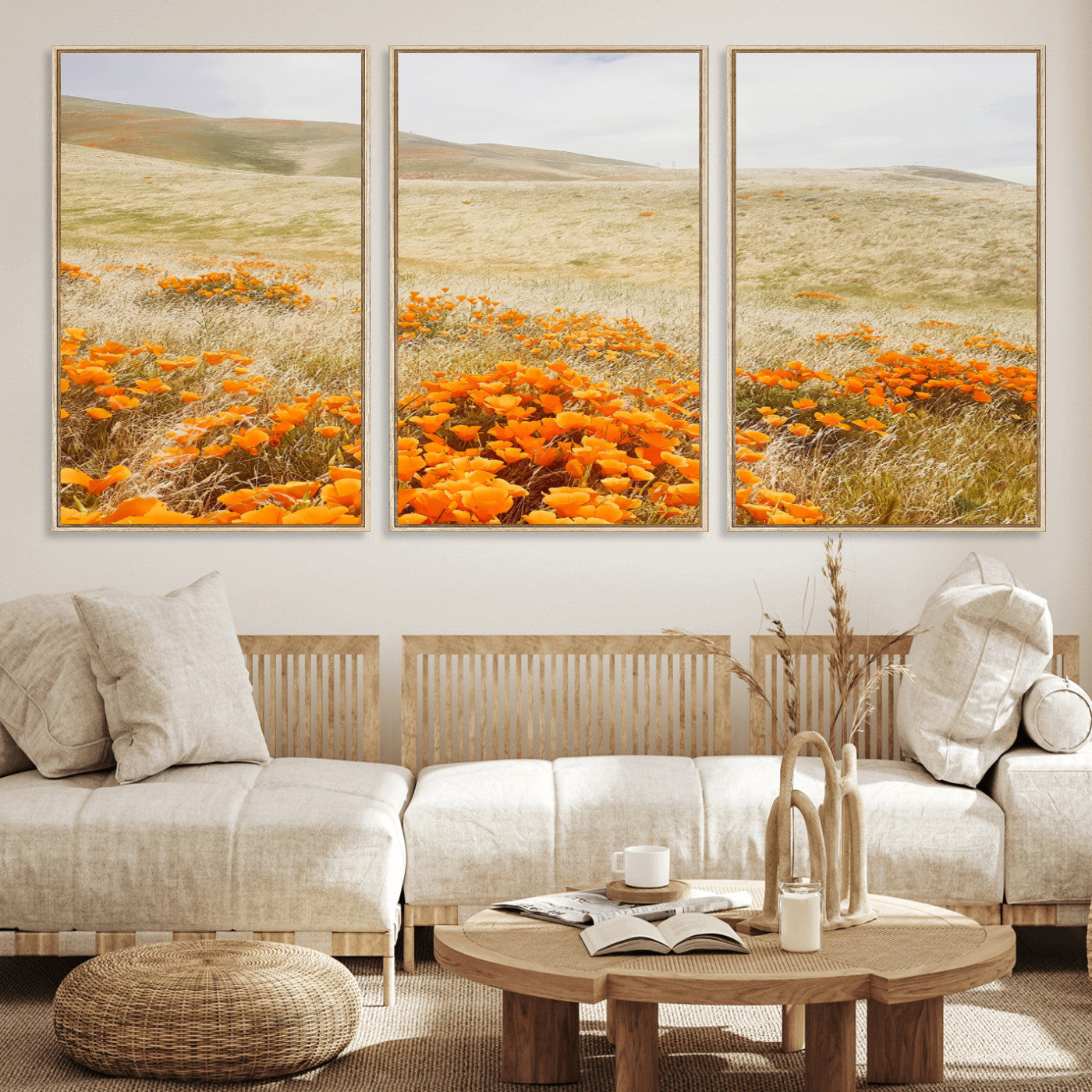 A golden field with vibrant orange poppies blooming across rolling hills under a soft, sunlit sky, creating a warm and rustic landscape.