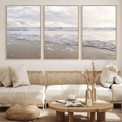 Peaceful ocean waves rolling onto the sandy shore under soft light, perfect for neutral or coastal minimalist decor themes.