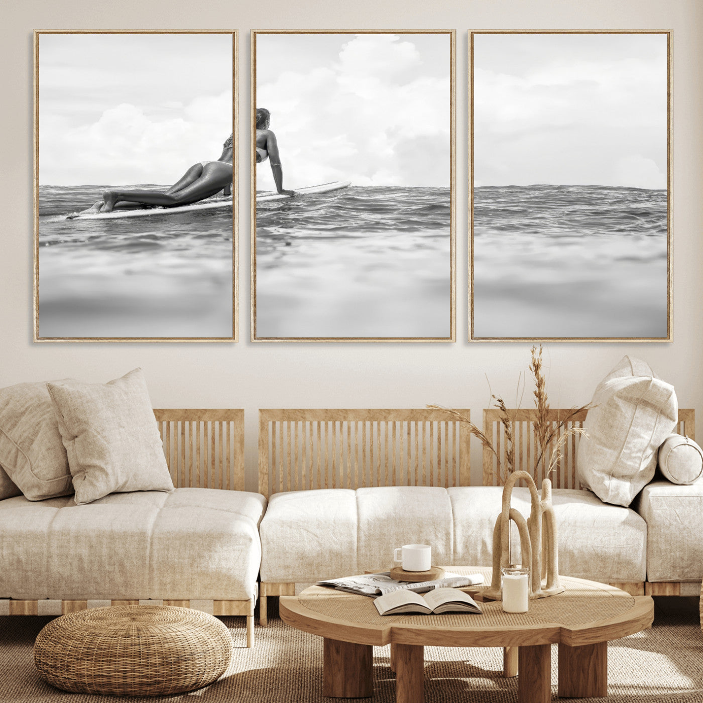 A black and white ocean scene featuring a surfer girl waiting on her board, gazing at the horizon, capturing a tranquil and adventurous coastal moment.
