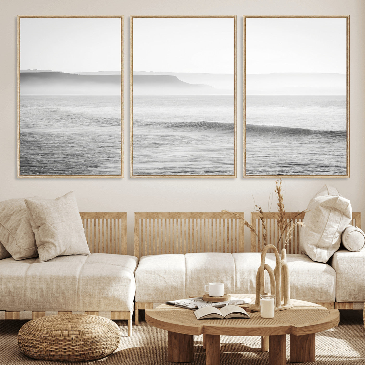 A black and white minimalist seascape featuring soft rolling waves and misty distant cliffs, creating a serene and timeless coastal atmosphere.