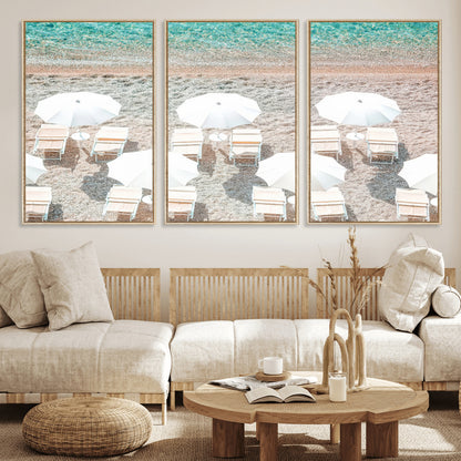 A bright beach scene with white umbrellas, pastel sand, and turquoise waters, creating a tranquil coastal vibe, perfect for beach house or summer decor.