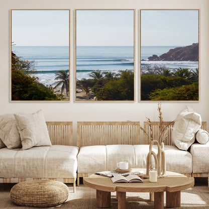 View of calm ocean waves with palm trees and a tropical coastline, ideal for coastal boho or beach-themed wall decor.