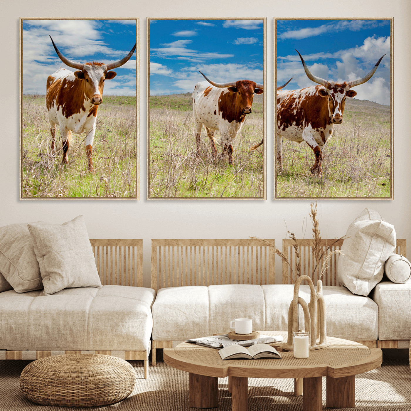 Three Texas longhorn cattle standing in dry grass under a bright blue sky, ideal for farmhouse or western rustic home decor.
