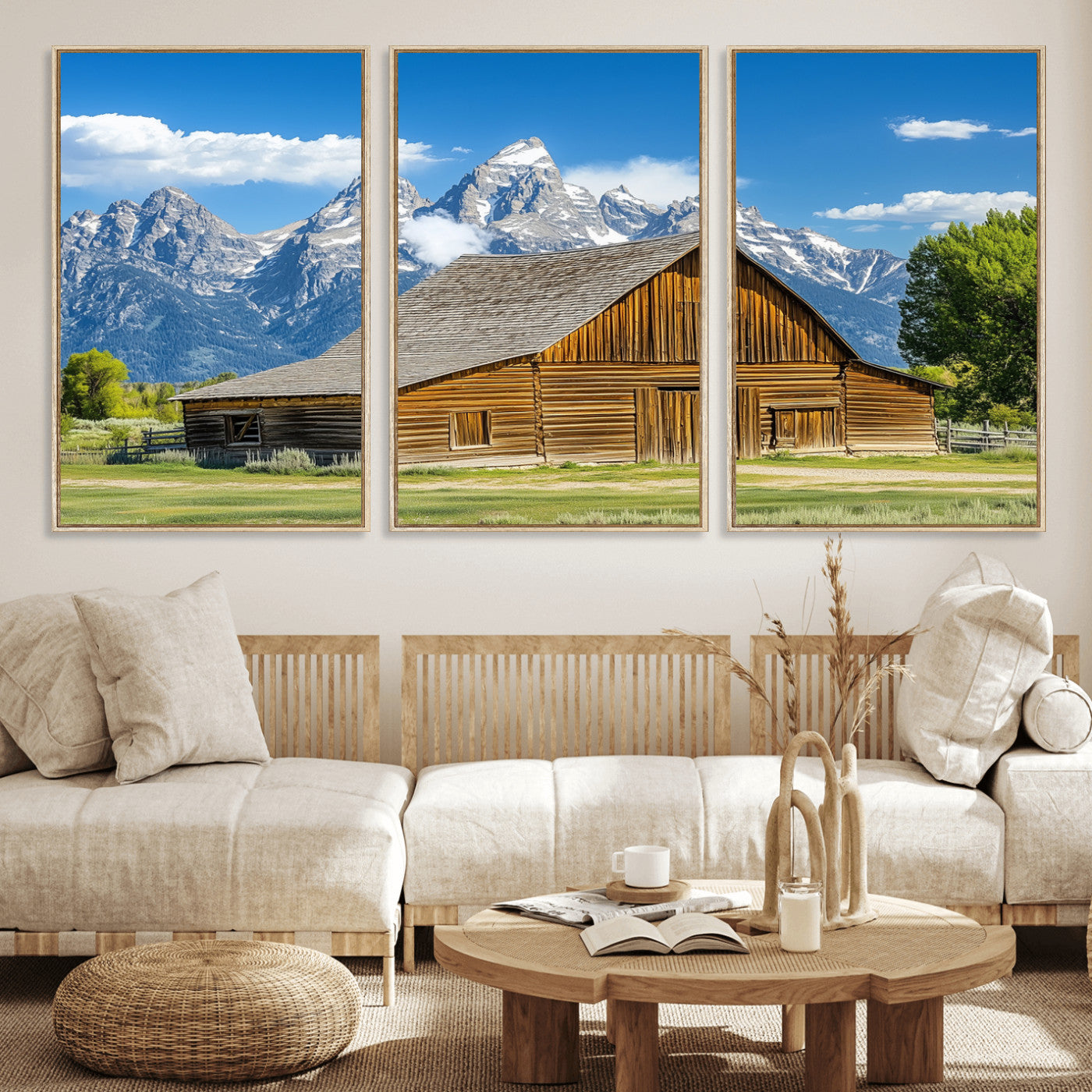 A rustic wooden barn sits in front of towering mountain peaks under a clear blue sky, perfect for farmhouse or cabin style interiors.