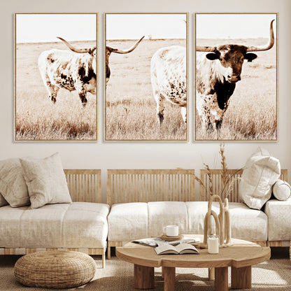Two Texas longhorn cows standing in a sepia-toned pasture, evoking rustic charm perfect for farmhouse or western country interiors. (