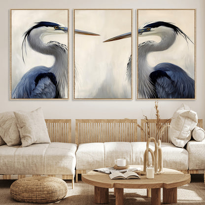 Two blue herons facing each other on a soft neutral background, ideal for coastal, tranquil, or nature-inspired minimalist interiors.