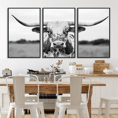 Capture the strength and elegance of nature with this striking black and white portrait of a longhorn cow. Its powerful presence makes a bold statement in any room.