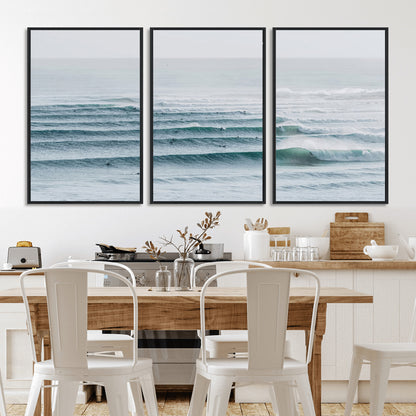 High-angle view of surfers lining up across layered ocean waves, ideal for minimal coastal or surf-inspired room decor.