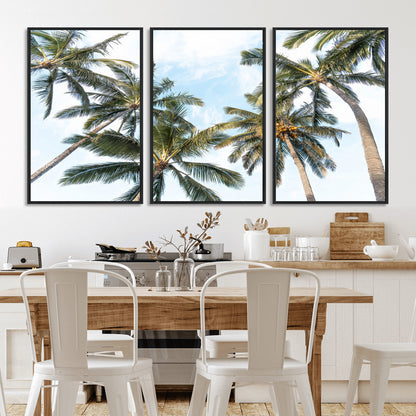 Framed canvas of tall palm trees reaching into a tropical sky, ideal for beach home or relaxed island-inspired wall decor.