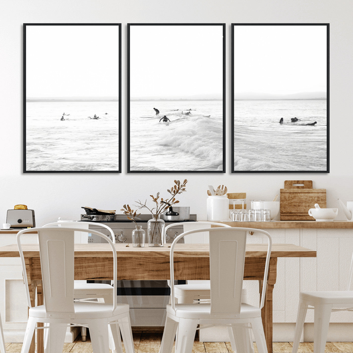 Monochrome photo of surfers riding and waiting on ocean waves, ideal for surf-themed or coastal energy wall decor.