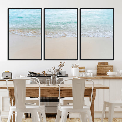 Soft shoreline with gentle aqua waves on smooth sand, ideal for minimalist coastal or pastel ocean-inspired home wall decor.