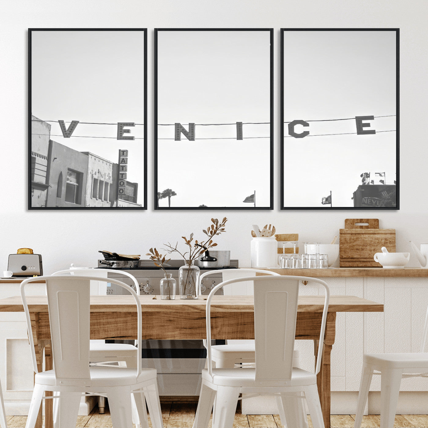 Black and white photo of Venice Beach sign and palm-lined street, perfect for urban coastal or minimalist LA-inspired wall decoration.