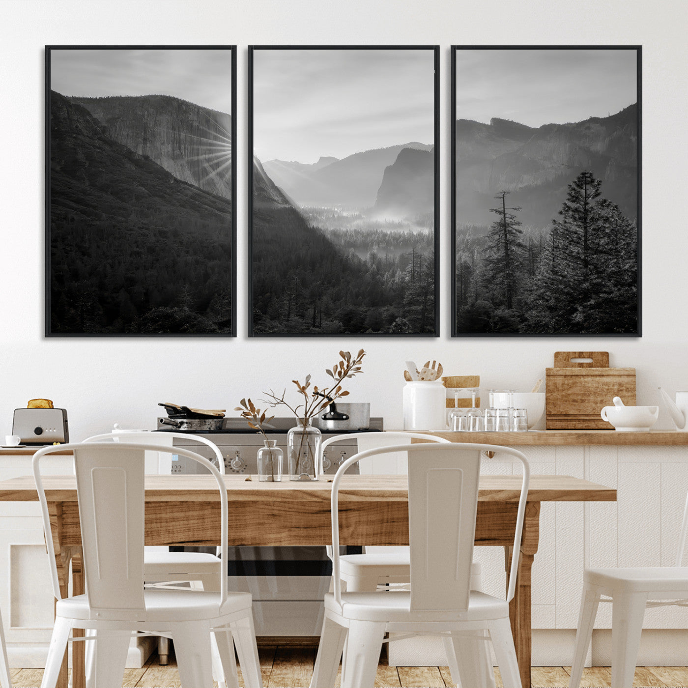 Black and white landscape of Yosemite with sun rays peeking over El Capitan, ideal for moody nature or modern rustic decor.