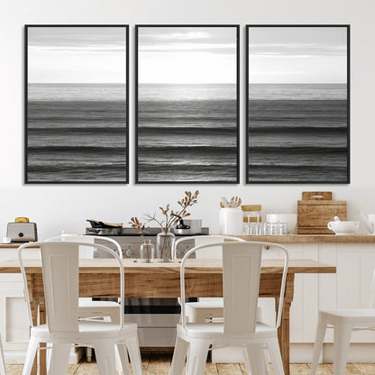 Minimalist black and white ocean view with layered waves reflecting sunlight, evoking a sense of calm and coastal serenity.