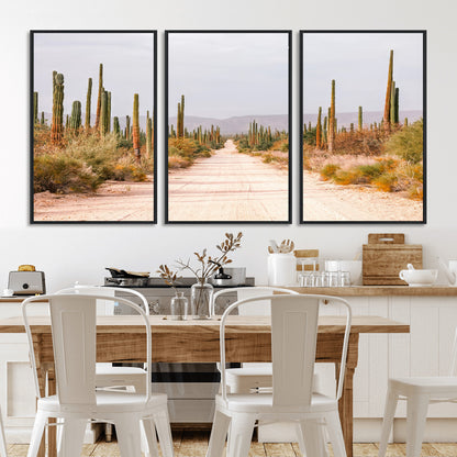 A desert road lined with saguaro cacti under a golden sky, creating a warm southwestern feel, perfect for boho or rustic decor.
