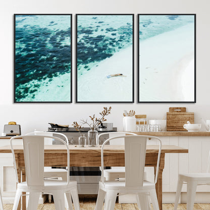 Canvas featuring an aerial view of a swimmer in shallow turquoise waters with coral patterns, ideal for tropical coastal home decor.