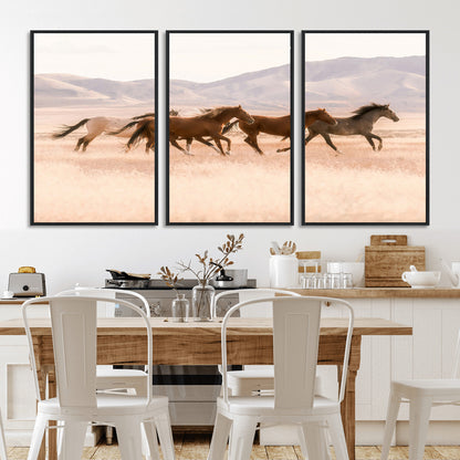 A herd of wild horses galloping through a sunlit desert plain with mountains in the background, perfect for rustic or western-themed wall decor.