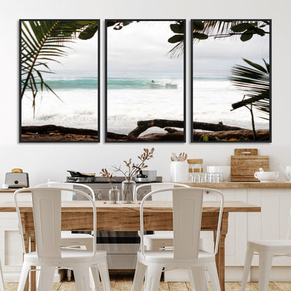 Tropical beach view with palm trees and surfer riding a wave, perfect for boho or coastal-inspired interior wall decor.