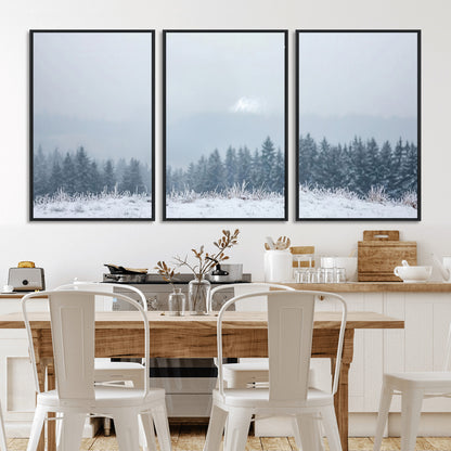 Snow-covered forest under misty sky, soft light breaking through clouds, ideal for minimalist or Nordic-inspired home decor.