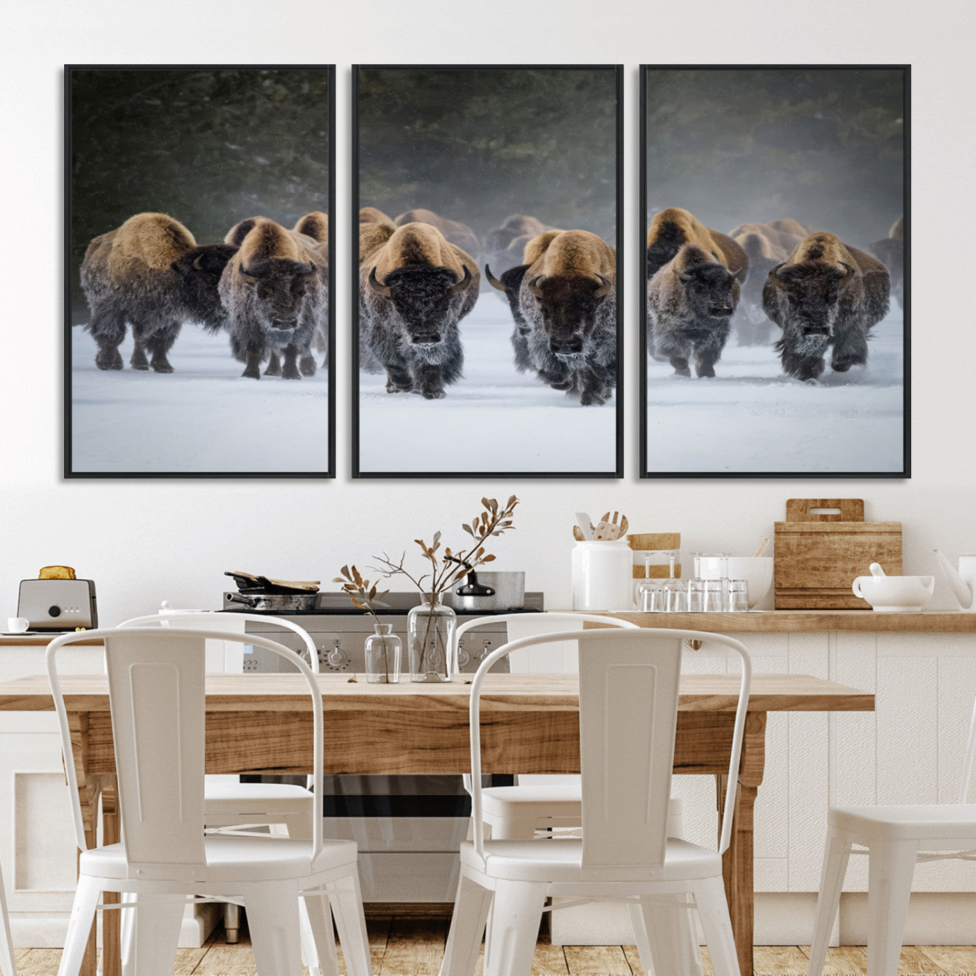 A herd of American bisons walking through deep snow in a forest, evoking a powerful rustic wilderness mood for western-style interiors.
