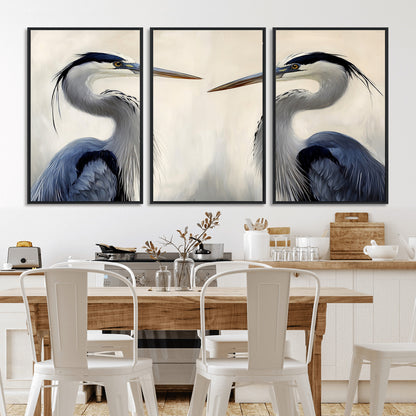 Two blue herons facing each other on a soft neutral background, ideal for coastal, tranquil, or nature-inspired minimalist interiors.