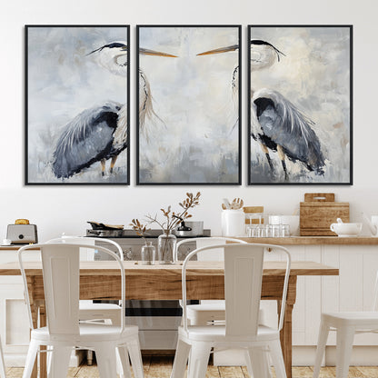 Two herons facing each other on a soft-toned background with blue-grey feathers, perfect for tranquil, coastal or nature-themed interiors.