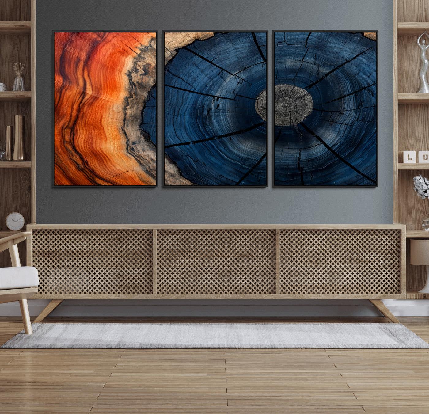 A captivating close-up of a tree trunk, showcasing its concentric rings in rich shades of blue, orange, and brown, highlighting the organic patterns of natural wood.