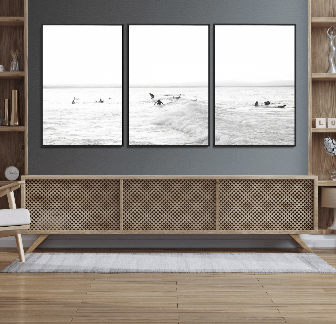 Monochrome photo of surfers riding and waiting on ocean waves, ideal for surf-themed or coastal energy wall decor.