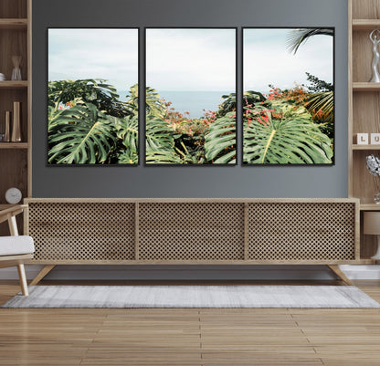 Monstera leaves and tropical flowers framing a calm ocean view, ideal for tropical coastal or exotic jungle-style interior wall decor.