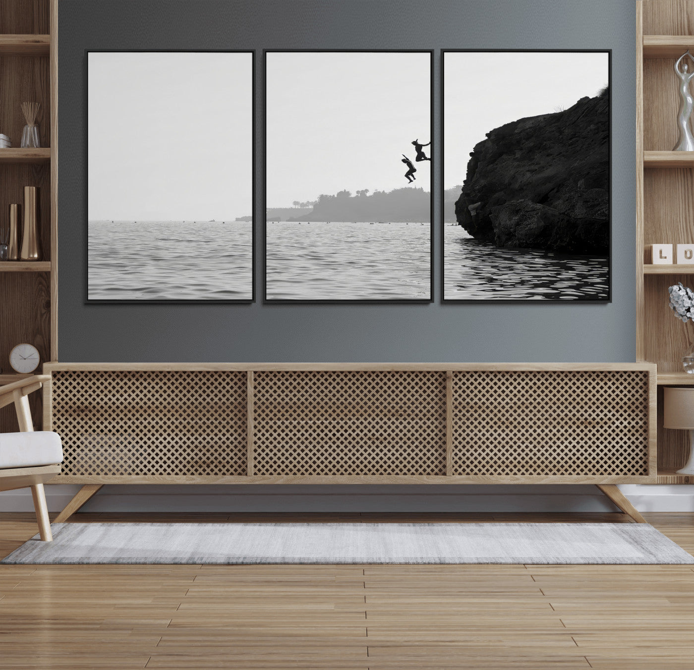 Black and white canvas of two figures cliff jumping into the sea, captured with moody tones, ideal for modern coastal or adventure-themed home decor.   2/2
