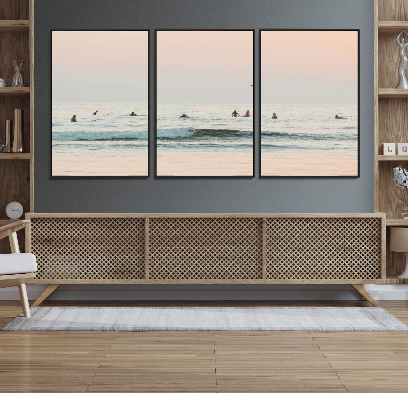 Dreamy photo of surfers waiting on soft pastel waves under a pink sunset sky, ideal for soft coastal minimalist or serene ocean-themed home decor.