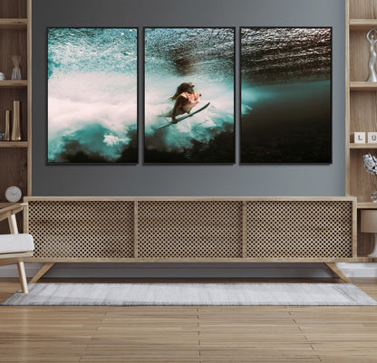 Vibrant underwater photo of a female surfer diving through turquoise waves, perfect for coastal boho or surf-inspired home decor.