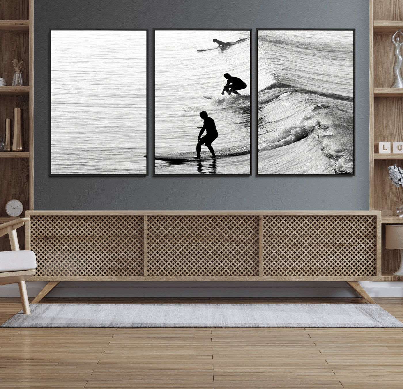 Black and white photo of surfers riding waves in a moody, high-contrast scene, ideal for modern coastal or surf-inspired home decor.