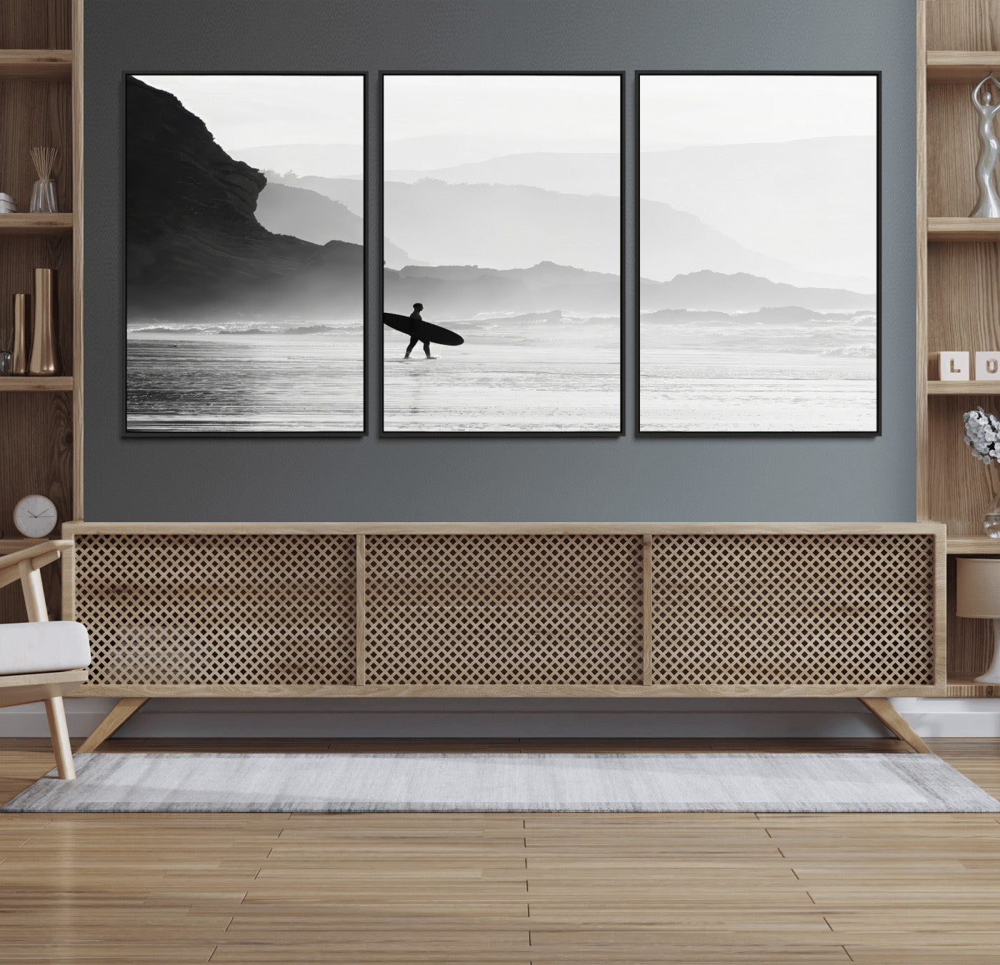 A lone surfer walking along a misty beach with cliffs in the background, carrying their board, capturing a serene and minimal ocean moment.