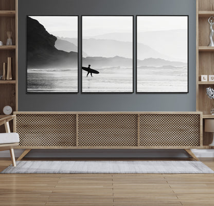 A lone surfer walking along a misty beach with cliffs in the background, carrying their board, capturing a serene and minimal ocean moment.