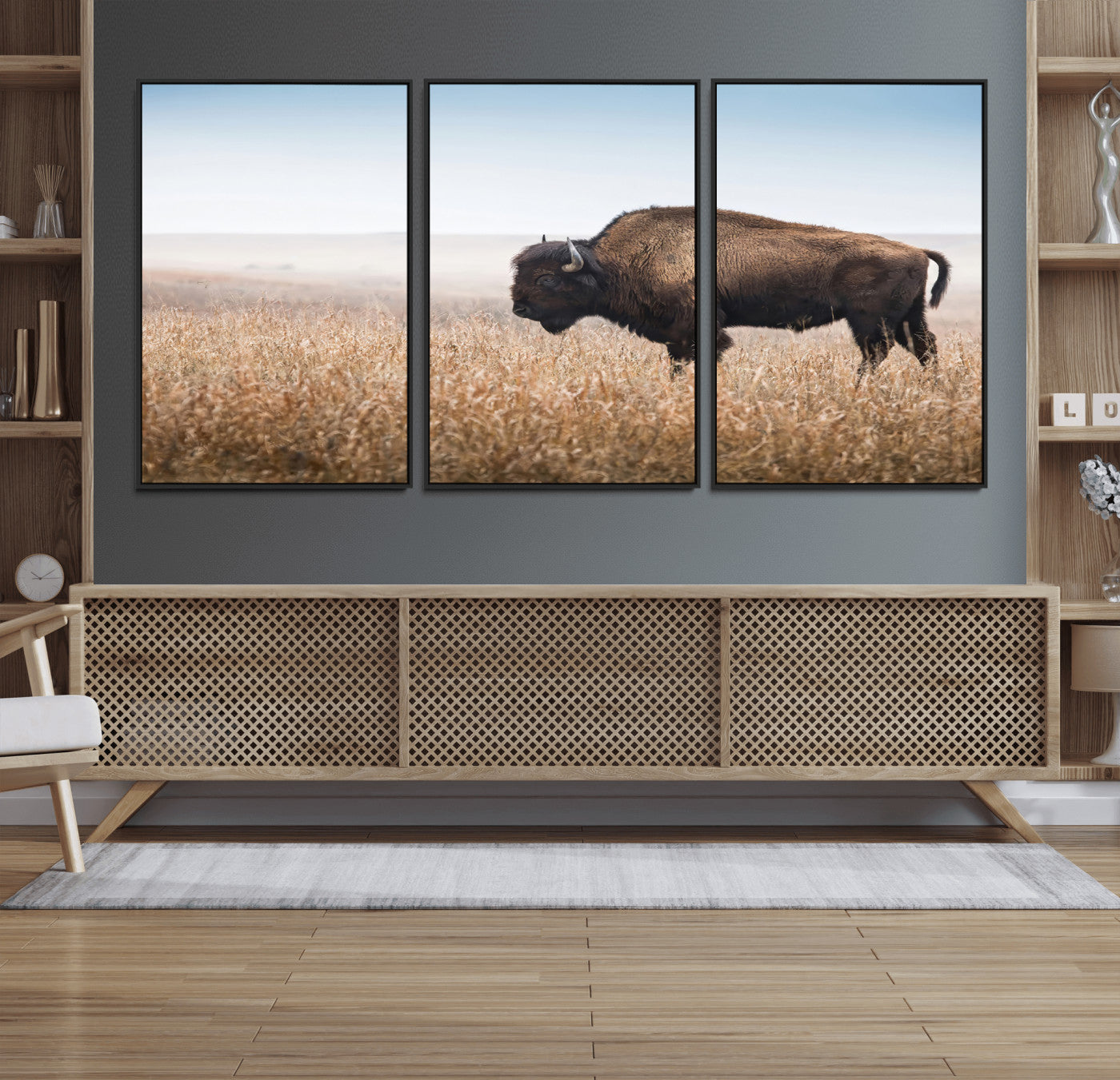 A majestic bison standing in an open prairie field, its strong form blending into the golden grass under a vast blue sky, evoking the wild spirit of the American plains.