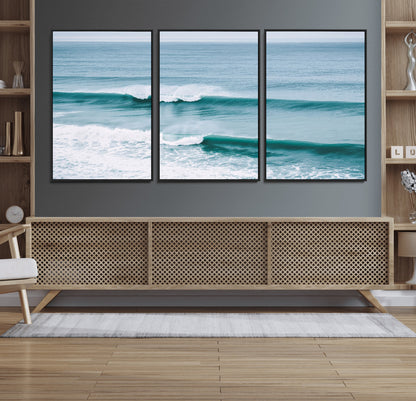 Powerful ocean waves rolling towards the shore, their turquoise hues blending with white sea foam under an open horizon, capturing the essence of the ocean's movement.