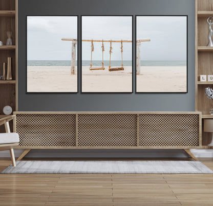 A rustic wooden beach swing stands on a serene sandy shore with an ocean horizon in the background, creating a tranquil and dreamy coastal escape.