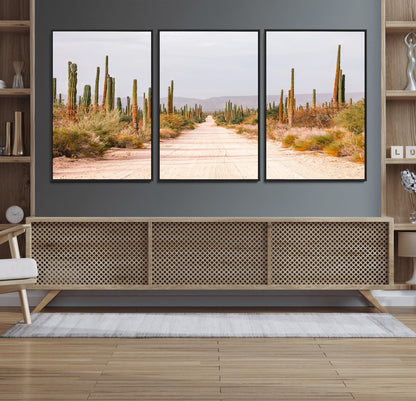 A desert road lined with saguaro cacti under a golden sky, creating a warm southwestern feel, perfect for boho or rustic decor.