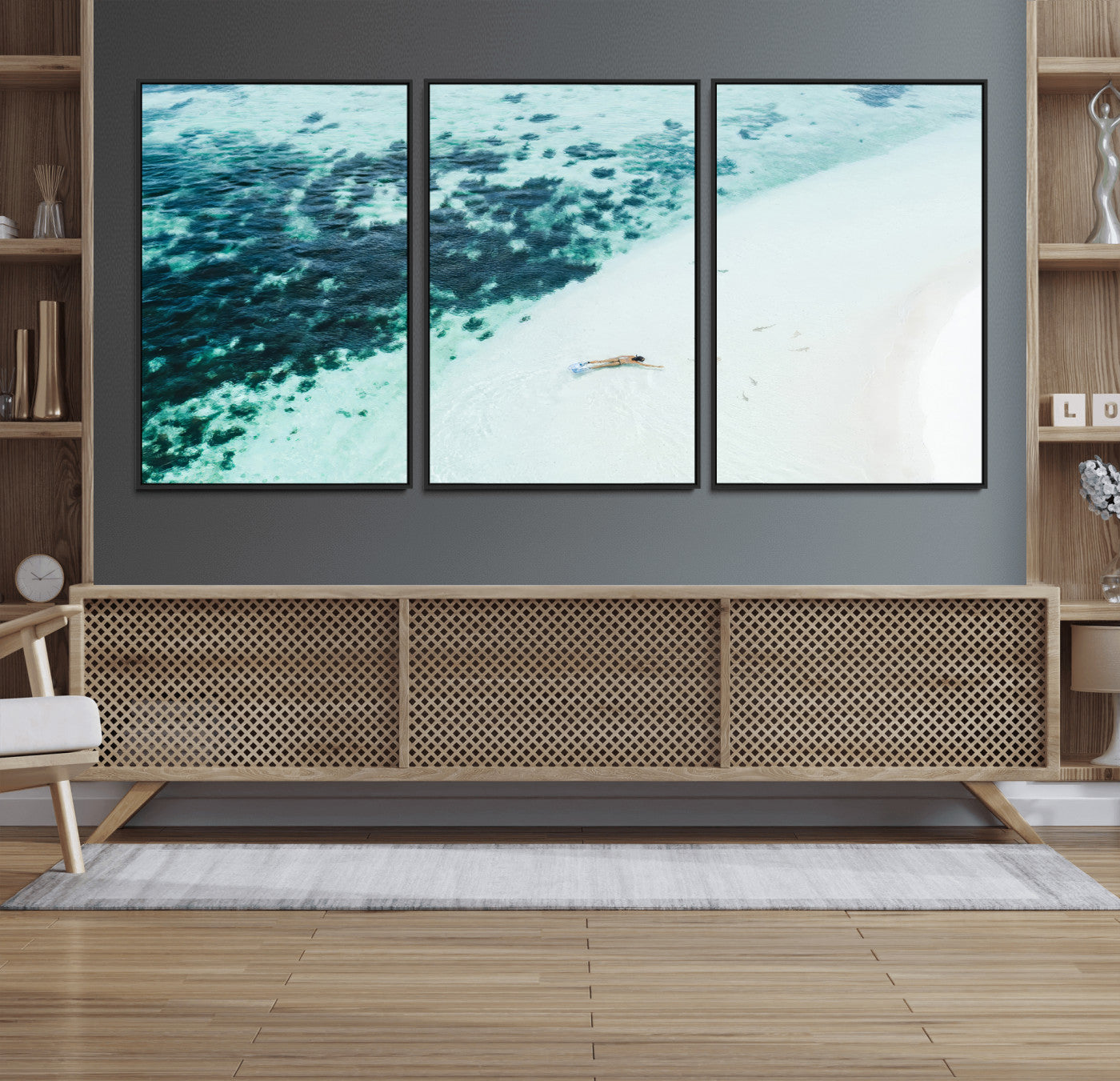 Canvas featuring an aerial view of a swimmer in shallow turquoise waters with coral patterns, ideal for tropical coastal home decor.