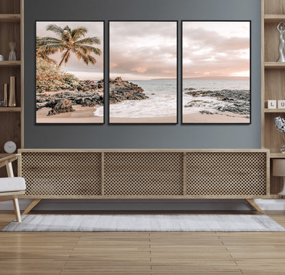 A peaceful beach scene with a palm tree and rocks, soft waves washing onto the shore under a soft pastel sky at sunset.