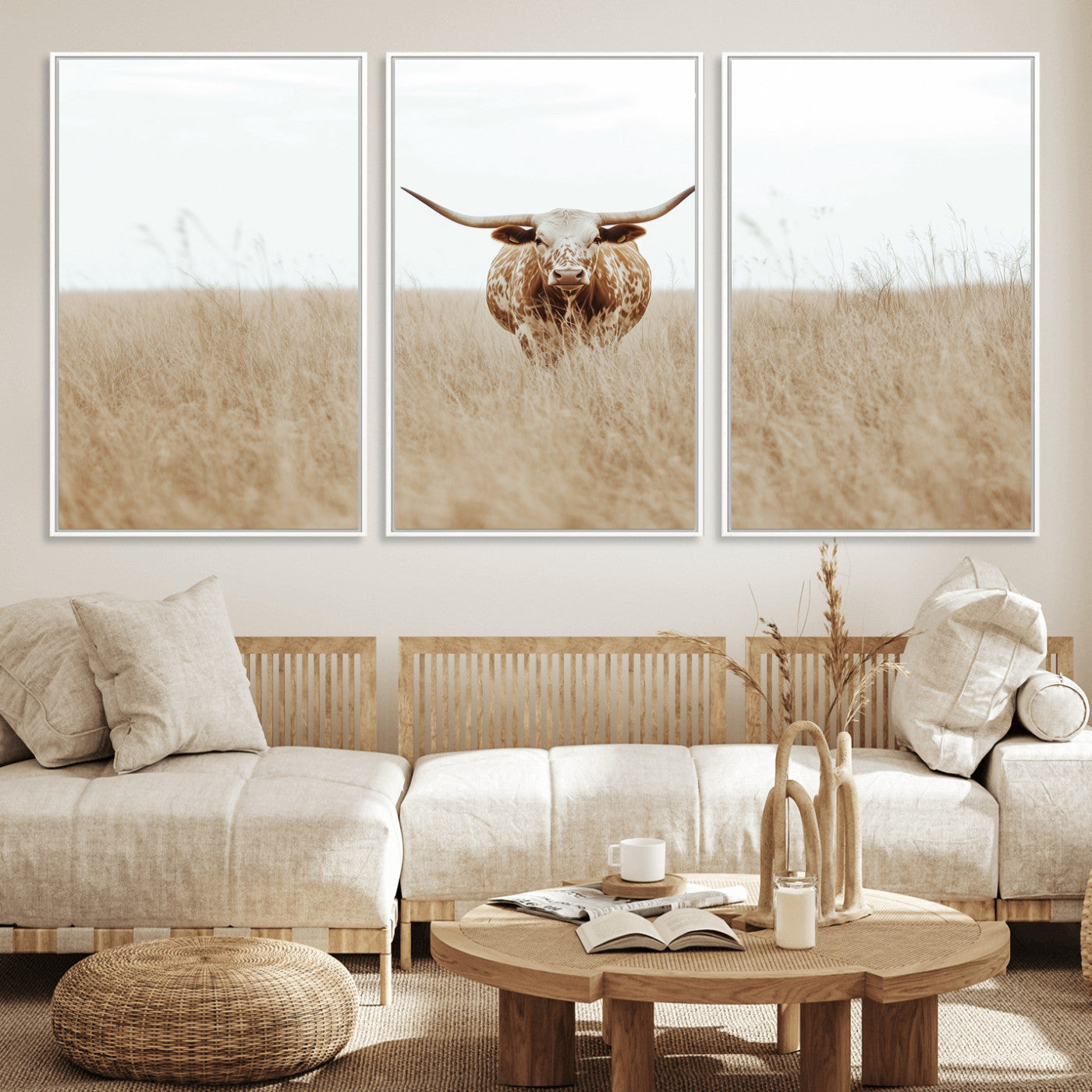 Texas Longhorn bull standing alone in dry grass with neutral tones, ideal for rustic western or cowboy-themed wall decor.